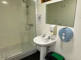 Private shower rooms with attached toilets