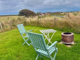 Chairs and fire pit available
