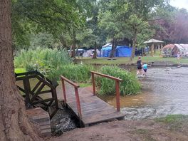 Kids love the stream. with the bridge