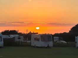 Watching the sun set over campsite