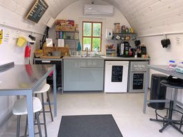 Reception and honesty room with seating on the left