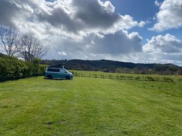 Our electric grass pitch with stunning views, near to the river