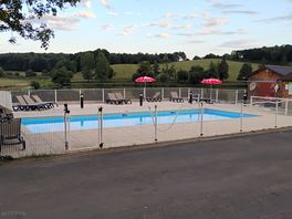 The swimming area is elevated with lovely views over the lake and lush countryside beyond.