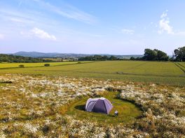 A wider view overlooking the site towards the Malvern's