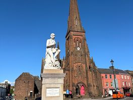 Robert burns statue and cathedral in dumfries