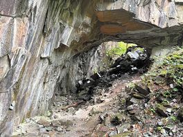 Rock formation on woodland walk along derwent river