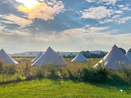 Glamping tents in the morning sun