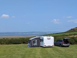 Spacious camping ground with scenic views.
