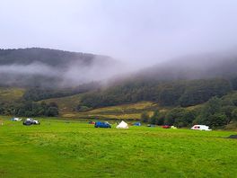 Storm clouds rolling over the hills to camp.