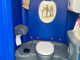 Portaloo clean functional with seaside post card humor