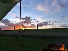 Fire at night whilst watching the sunset