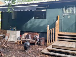 Zeus shepherd's hut outside entrance/kitchen/seating area