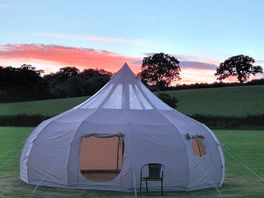 Beautiful sunset at camp site , stargazer tent