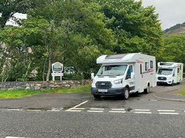 Camper vans leaving the site