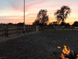 Beautiful sunset around the fire pit .