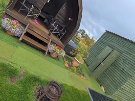 The cabin, facility shed, hot tub, firepit & outdoor seating