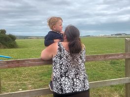 Youngest boy watching the aircraft take off on the airport next door