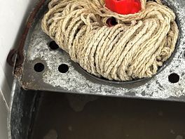 The bucket full of dirty water