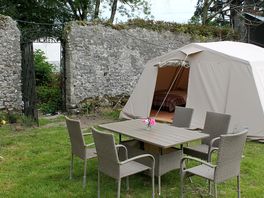 The safari tent and outdoor seating