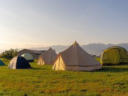 Tent pitches at sunset