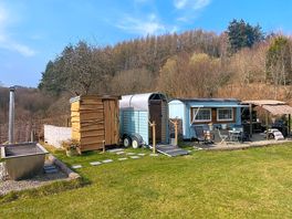 View of hot tub, toilet, shower, Shepherd's hut & kitchen
