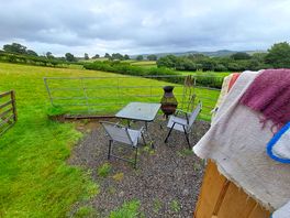 All ours-enclosed seating area & own private field beyond!