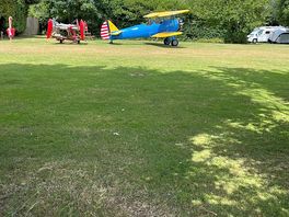 Stearman biplane behind our pitch.