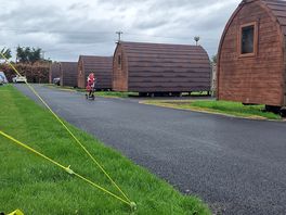 Pods on the 'inside' of the freshly laid road around the touring pitch