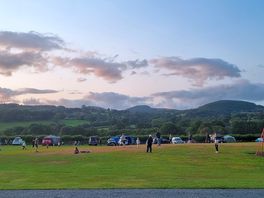 Family game of rounders on the play field