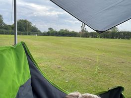 The view of the dog walking area in the distance