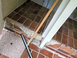 Sharp edges of broken tiles around toilets and showers