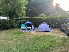 Large well kept pitches with a mix of camper vans and tents