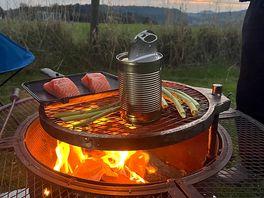 Cooking our tea. we’d forgotten a pan so heated tinned potatoes in the can.