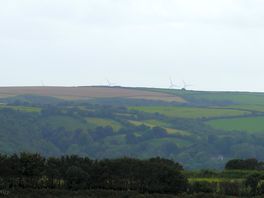 The wind turbines far over the hills