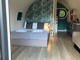 Living area with large double bed