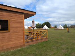 Bell tent and mini chalets.