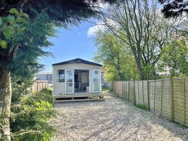 The Retreat with patio doors opening West from the living space & a secure parking and garden area