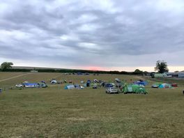 Site at sunset. large pitches for tent and car and firepits.