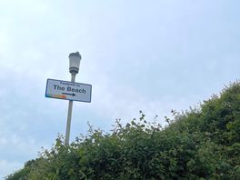 Sign to the beach walk