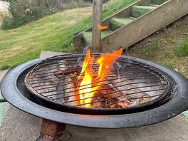 Fire pit by camping pod