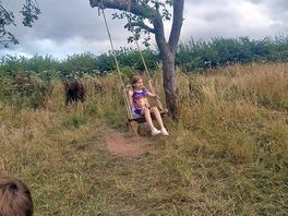 Children enjoying the swing