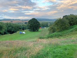 View from the top field just past the hop field, looking down at the bottom field by the river