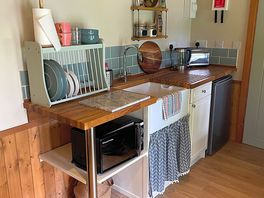 Kitchen area - there is a table and two chairs opposite the kitchen that is not in the photo