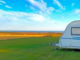 Pitches with distant sea views