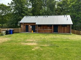 Borders well maintained facilities. upstairs for tented site. down stairs for motor homes