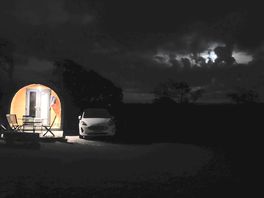 Camping pod at night.