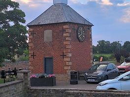 Village clock tower outside barrys fish and chips