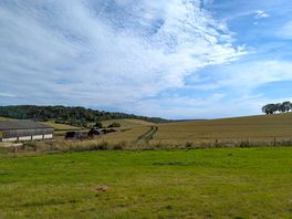 Farm and surrounding hills