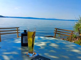 Cool draught beer at the bar on the lake