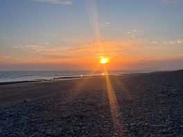 Sun set on while walking on the beach